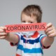 Young child wearing a respiratory mask as a prevention against the deadly Coronavirus Covid-19