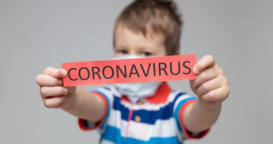 Young child wearing a respiratory mask as a prevention against the deadly Coronavirus Covid-19
